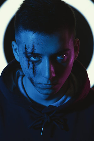 Teenage boy with wounds on face. Bullying and harassment.