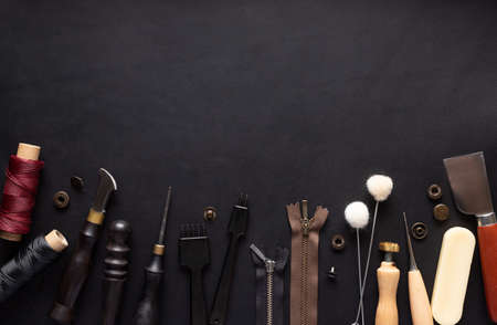 border of various tools for sewing leather goods. Handmade wallets, belts, bags.の写真素材