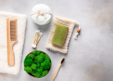 Zero waste concept. reusable cotton pads, natural herbal soap, soap saver and stabilized moss in pot