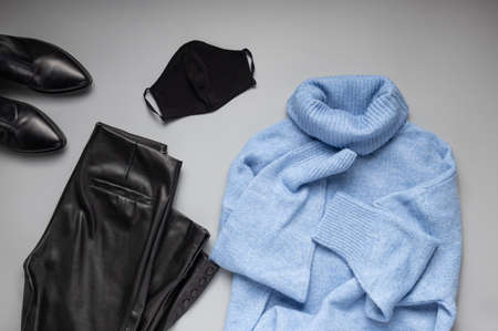 Set of womens outfits autumn, winter clothes with black face protective maskの写真素材