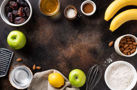 vegan dessert ingredients and utensils on dark backgroundの写真素材