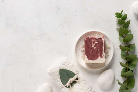 soap bar with natural ingredients, towel on white backgroundの写真素材