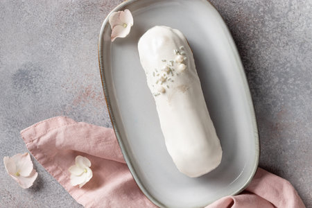 white chocolate eclair in ceramic plate