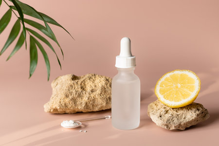 beauty product with vitamin C on beige backgroundの写真素材