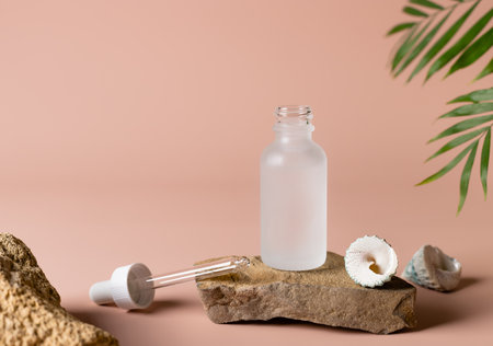 Cosmetic product in open glass bottle with dropperの写真素材