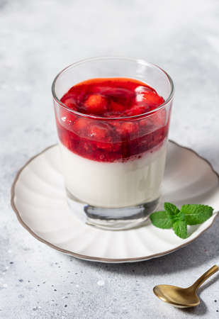 Vegan coconut panna cotta with strawberriesの写真素材