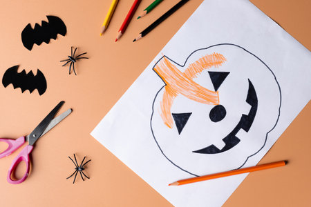 Halloween decoration with stationery on orange color backgroundの写真素材