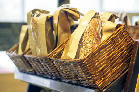 Bread, lying in a wicker basket on the counter in the supermarketの写真素材