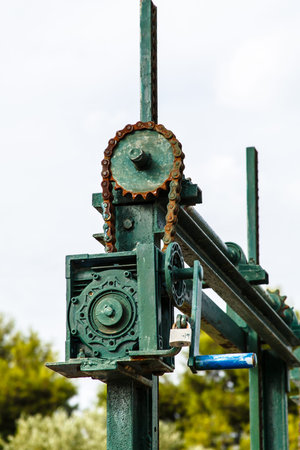 The old mechanism for shutoff of water in the channel, the chainの写真素材