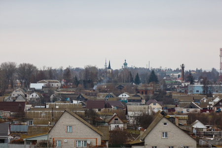 A small town in Central Russia. small house,Well hill Orthodox Church. Late very.の写真素材