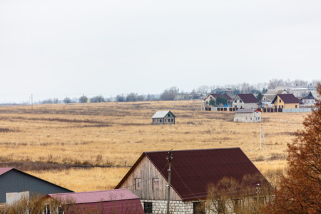 A small town in Central Russia. small house,Well hill Orthodox Church. Late very.の写真素材