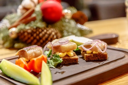 Traditional Russian food: herring fillet with black bread and onions.の写真素材