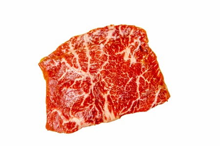 Raw steak Flat Iron Steak beef lies on a white background. Marbled meat. This is - "Flat Iron Steak", as it needs to be cut.の写真素材