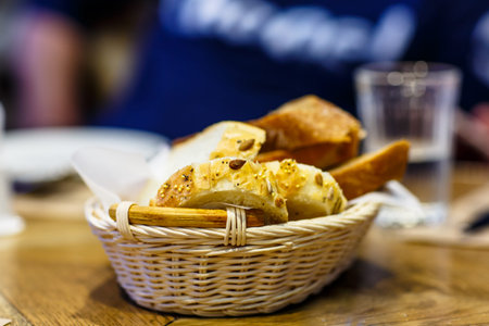Slices of wheat bread with sesame and beans are basket.