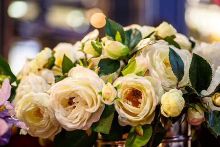 Yellow (cream) rose flowers stand in a large vase. It is possible that this flower shop.の写真素材