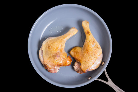 Chicken legs fried in a skillet. Insulatedの写真素材