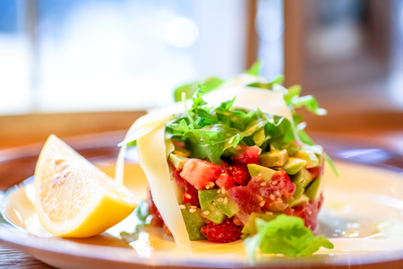 Salad with avocado, strawberries and arugula in a ring.の写真素材