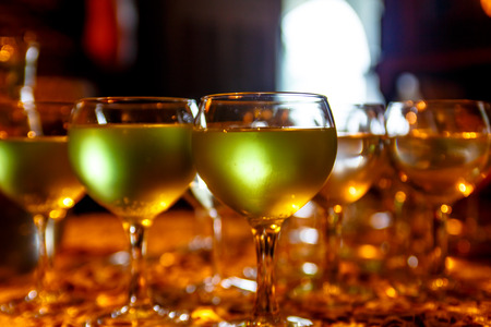 Green lemonade or cocktail in glass wine glasses.の写真素材