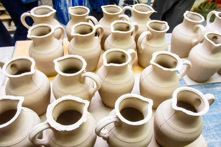 A pottery. A lot of different dishes that are ready for roasting.の写真素材
