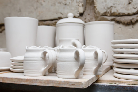 A pottery. A lot of different dishes that are ready for roasting.の写真素材