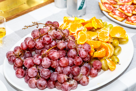 Grapes lying on a plate for a picnicの写真素材