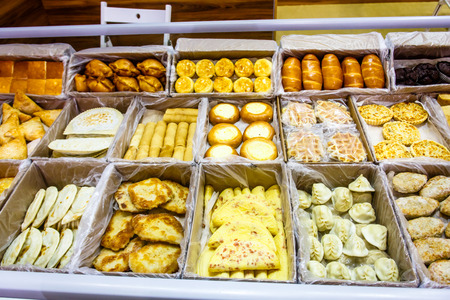 Frozen foods: pancakes, cheesecakes, dumplings are on display.の写真素材