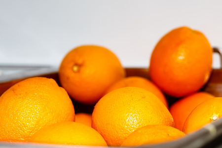 Some oranges are in the bowl.の写真素材