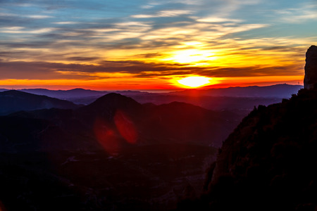 Morning dawn the sun rises over the mountains.の写真素材