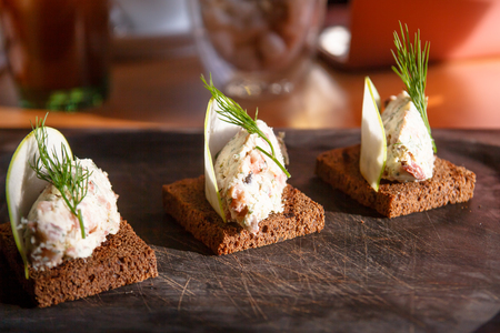 Pate with salmon lies on a piece of breadの写真素材