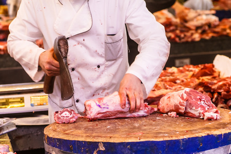 Meat seller in the market, a lot of different meat.の写真素材