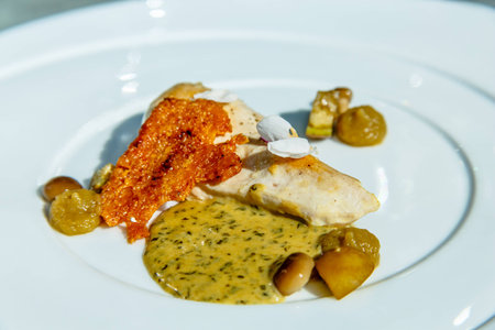 Fried chicken breast with mustard sauce, bread chips and mushrooms.の写真素材