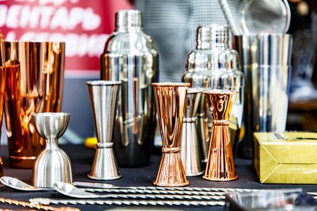 Copper jigger for cocktails is on the bar.の写真素材