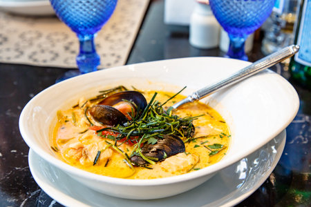 Cream soup with seafood, shrimp, mussels, langoustines, fish