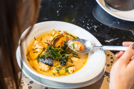 Cream soup with seafood, shrimp, mussels, langoustines, fish