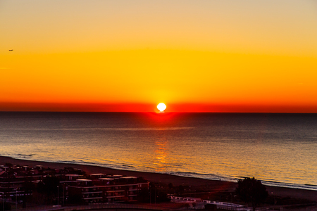 The sun rises (sunrise) over the sea, early morningの写真素材