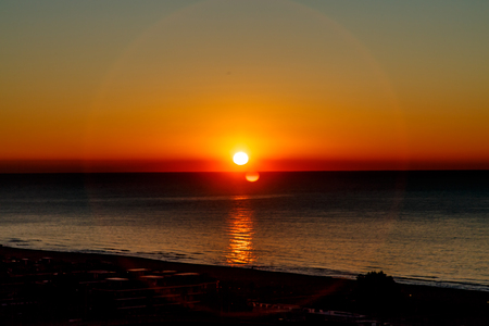 The sun rises (sunrise) over the sea, early morningの写真素材