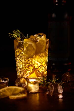 Red cocktail with lemon slice and Appleの写真素材