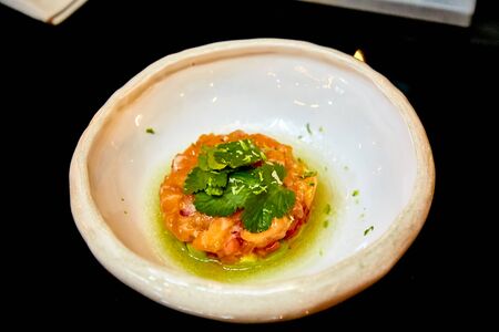 Salmon ceviche is in the plateの写真素材