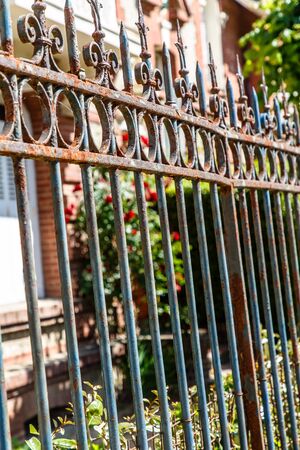 Old rusty metal fence in the garden.の写真素材