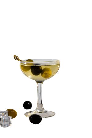 A classic Martini cocktail with vodka and olives is poured in a glass on a white background. Isolatedの写真素材
