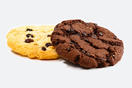 Chocolate chip cookies with raisins isolated on a white background