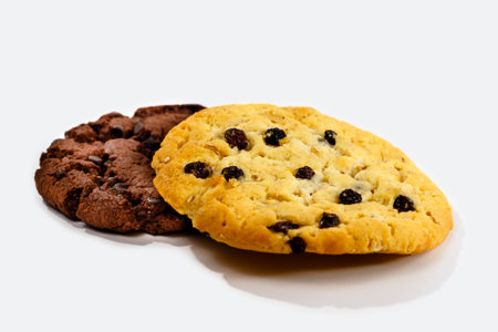 Chocolate chip cookies with raisins isolated on white background.の写真素材