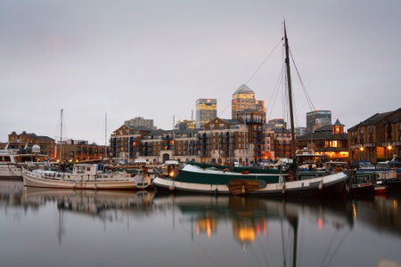 Evening in the docks of Limehouse Basin with Canary Wharf in the background のeditorial素材