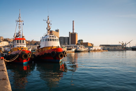 Athens, Greece  May 2 2014  Tugs in port of Piraeus at sunset, Athens のeditorial素材