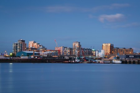 London skyline with London Eye reflecting on river Thames のeditorial素材