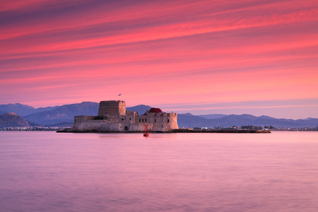 Sunset over Bourtzi castle in Nafplio, Greece.の写真素材