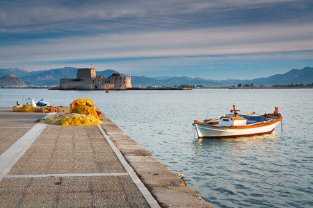 Fishing nets and a fishing boat in Nafplio, Peloponnese, Greece.のeditorial素材
