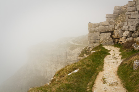 Foggy Coast Path in abandoned quarry in Portland Bill, Dorset, UK.の写真素材