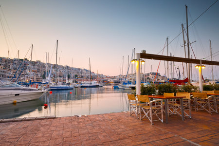 Sail boats at the coffee shop of the yacht club in Mikrolimano marina in Athens, Greeceのeditorial素材