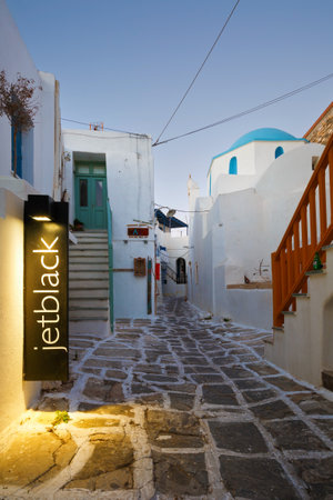 Street with traditional architecture and a church in the old part of Naousa village on Paros island, Greeceのeditorial素材